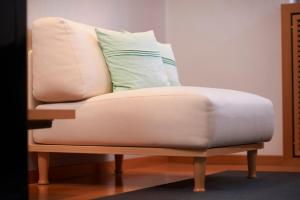 a chair with a pillow on top of it at RomanticHOTEL Goldener Karpfen - das kleine, feine Grandhotel direkt in der Altstadt in Fulda