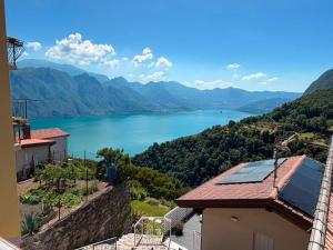 a view of a lake from a house at Cottage di Lola in Fonteno