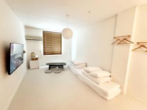 a living room with a couch and a table at 브릭스테이 brikstay in Gyeongju