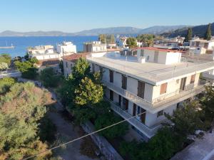 an aerial view of a building next to the water at Puente Rooms in Methana