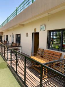 a group of benches on the deck of a building at La ferme labyed in Fez