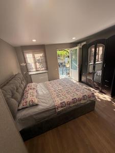 a bedroom with a large bed in a room at Heart of Mtskheta Studio Apartment in Mtskheta