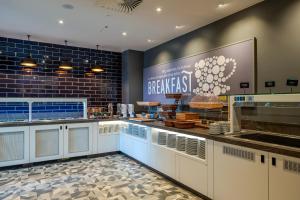 a bakery with a large sign on the wall at Premier Inn Bremerhaven in Bremerhaven