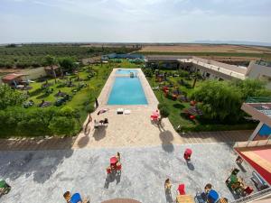 an overhead view of a pool at a resort at La ferme labyed in Fez