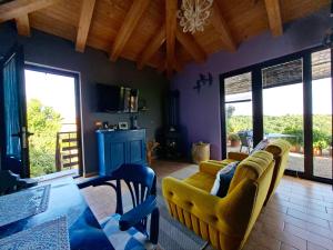 a living room with two couches and a table at Apartment Rosa Istria in Buje