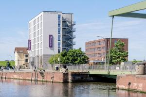 a bridge over a body of water with buildings at Premier Inn Bremerhaven in Bremerhaven