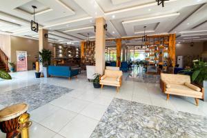 a lobby with couches and chairs in a building at Mozza Beach Resort in York