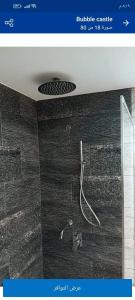 a screenshot of a bathroom with a shower at Bubble Castel Boutique Hotel in Kerak +88 photos