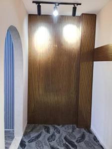 a room with a large wooden door in a room at Bubble Castel Boutique Hotel in Kerak