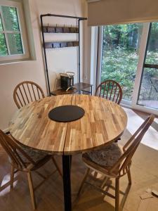 a wooden table and chairs in a room at oud in Zonnebeke