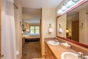 a bathroom with a sink and a mirror at Copper Springs Lodge 107 in Copper Mountain