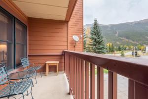 a balcony with chairs and a table and mountains at Copper Springs Lodge 107 in Copper Mountain +32 photos