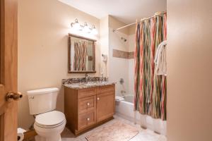 a bathroom with a toilet and a sink and a shower at Copper Springs Lodge 433 in Copper Mountain