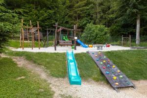 a playground with a slide in a park at Pod Břesteckou skalou in Břestek