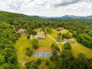 an aerial view of a home in the middle of the forest at Appalachian Mountain Lodge in Boone