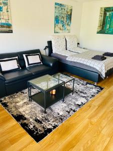 a living room with a couch and a coffee table at Relax Holidays in Rheinheim