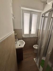 a bathroom with a sink and a toilet at Antica dimora Cauto in Pietramelara +12 photos