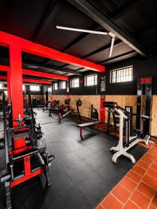 a gym with several treadmills and machines in it at hotel spa 360 villa de leyva in Villa de Leyva