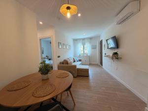 a living room with a table and a couch at Apartamento Torrox Village in Torrox