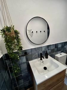 a bathroom with a sink and a mirror on the wall at Apartamento Torrox Village in Torrox +9 photos