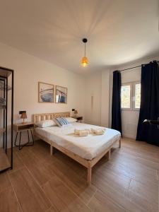 a bedroom with a large bed in a room at Apartamento Torrox Village in Torrox