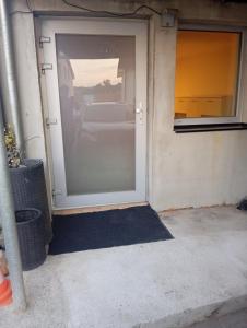 an open garage door with a car in it at apartmandomazlice in Domažlice