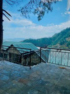 a metal fence with a view of a mountain at Snowra heights in Abbottabad