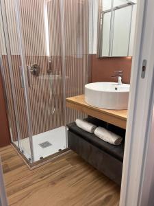 a bathroom with a shower and a sink at Anima Est in Naples