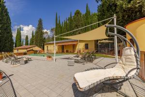 a group of chairs sitting on a patio at Casa Febea in Chiusi +21 photos