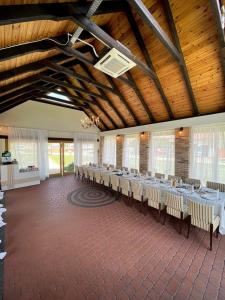 a large room with tables and chairs in it at Serce in Sokółka