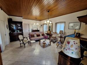 a living room with a couch and chairs at Casa di TSANES in Pinakokhórion