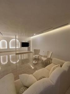 a living room with a couch and a table at Dar Llama in Nador