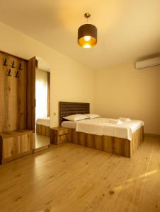 a bedroom with two beds and a window at Mos House in Kobuleti