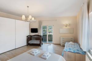 a bedroom with two beds and a chair in it at DIEGOPAS Sweet Home in SantʼAntonio Abate