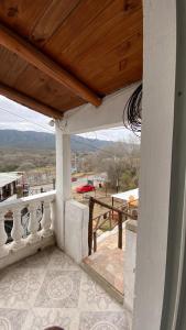 a balcony of a house with a view of the mountains at Terrazas Jorge y Claudia in Bialet Massé +5 photos
