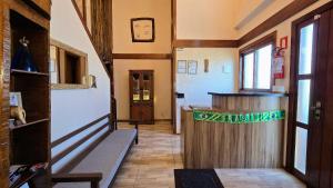 a hallway with a bar in a building at Residencial Borges Canela in Canela