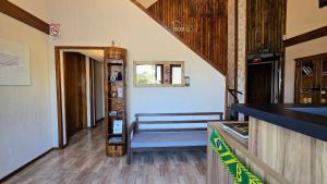 a room with a staircase with a blue bench in it at Residencial Borges Canela in Canela