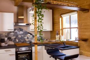 a kitchen with white cabinets and a sink and a window at Einfach.Ausspannen in Neumarkt im Mühlkreis