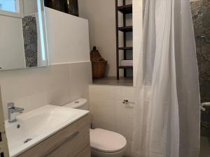 a bathroom with a toilet and a sink and a shower at Casa Caterina in Graniti +18 photos