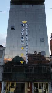 a hotel sign on the front of a building at El Refugio del Rey in Cajamarca