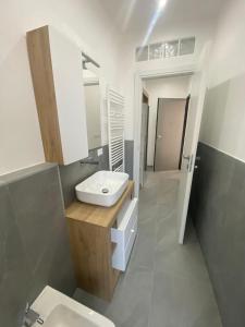 a bathroom with a sink and a toilet at CENTRAL LUXURY Rooms in Grugliasco +6 photos