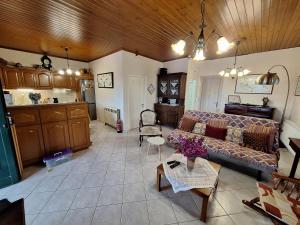 a living room with a couch and a table at Casa di TSANES in Pinakokhórion