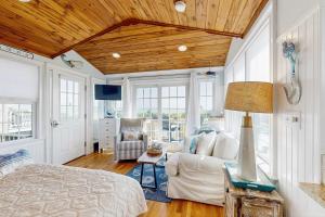 a living room with a bed and a couch at The Atlantic in Yarmouth