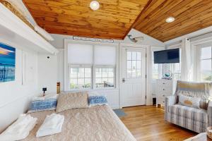 a living room with a couch and a tv at The Atlantic in Yarmouth +12 photos