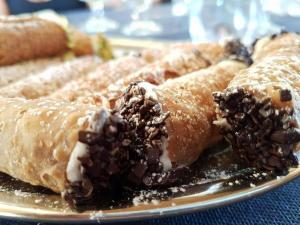 a plate of pastries with chocolate on it at Agriturismo Valle di Chiaramonte in Chiaramonte Gulfi