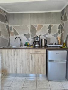 a kitchen with a sink and a dishwasher at Galini Apartments in Bali +16 photos