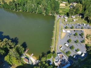 an aerial view of a lake with a parking lot at Forest Camping Resort Blaguš in Sveti Jurij ob Ščavnici +43 photos