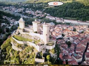 an aerial view of a castle on a mountain at Chalet GOURCE avec vue sur le Château in Foix