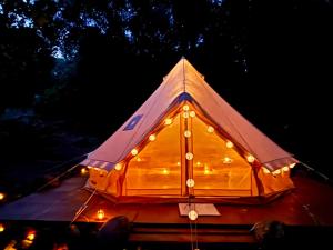 a large tent with lights on top of it at S'incantu in Burgos