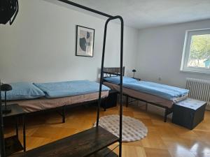 a room with two bunk beds and a mirror at Privát ANAMON Gaštanová in Kežmarok
